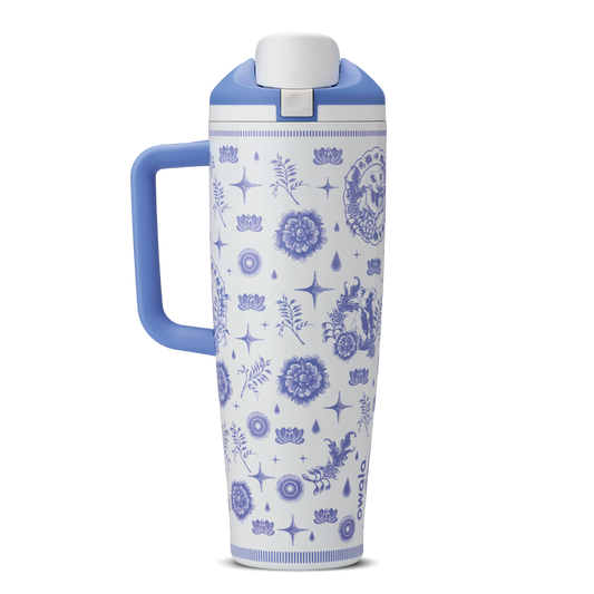 Heirloom 40oz Tumbler with handle; white body with blue delft-style illustrated pattern of stars, flowers, and charms; periwinkle blue handle and lid
